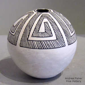Fine line and geometric design on a black-on-white seed pot