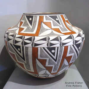Polychrome jar with a rain, kiva step and geometric design