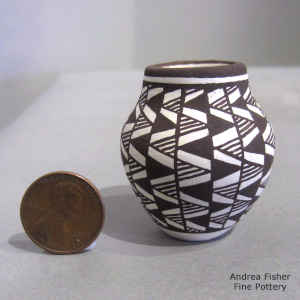 Geometric design on a miniature black and white jar