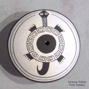 A Mimbres turtle and geometric design on a black and white seed pot