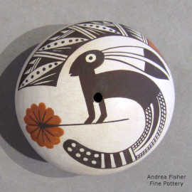 A Mimbres rabbit, flower and geometric design on a polychrome seed pot