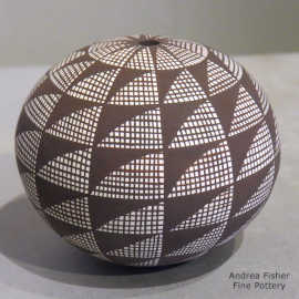 Fine line geometric design on a black-on-white seed pot