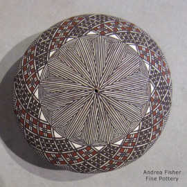 North Star fine line and geometric design on a polychrome seed pot