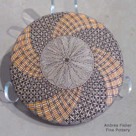 Fine line and spiral geometric design on a polychrome seed pot