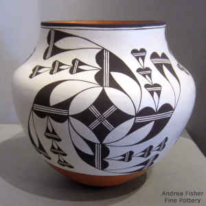 Medallion, cloud and geometric design in black and white on a polychrome jar jar