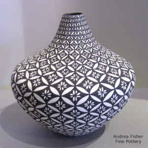 Snowflake geometric design on a polychrome tear drop jar