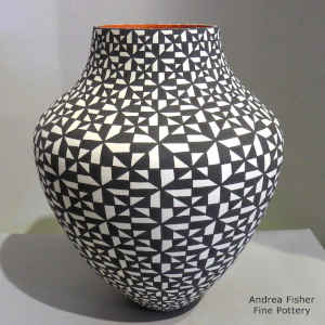Black and white geometric design on a polychrome jar