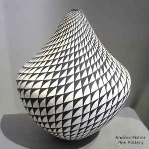 Spiral mesa geometric design on a black and white jar