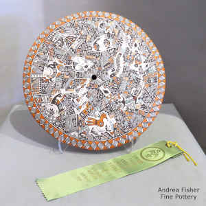 Mimbres animals and dancers with a geometric design on a large polychrome seed pot