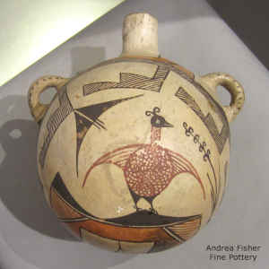 Bird, rain, flower and geometric design on a polychrome canteen