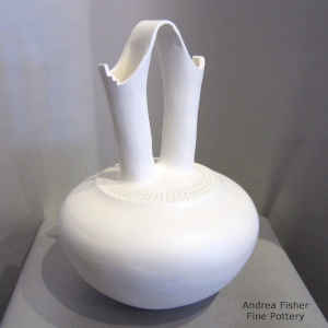 A band of corrugation around the neck of a white wedding vase