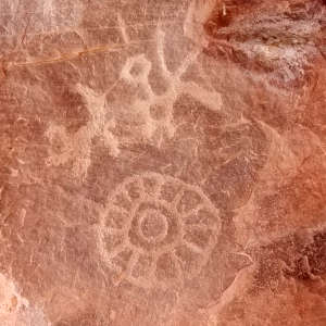 A petroglyph on a sheer rock wall at Chaco Canyon