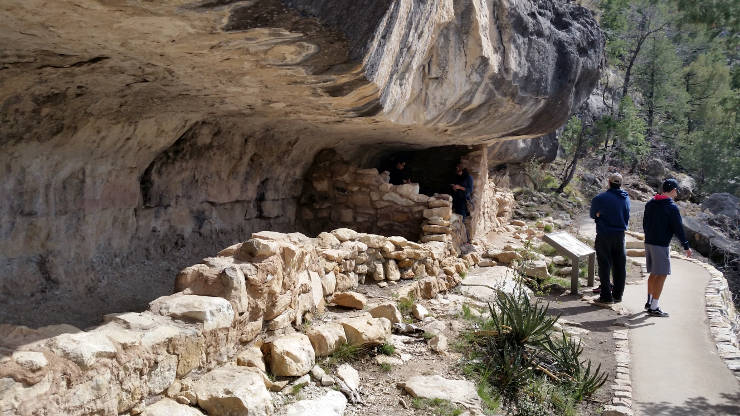 A reconstructed dwelling under an overhang in the canyon wall