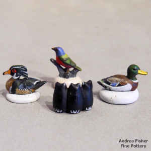 A set of 4 polychrome miniature animal and bird figures
