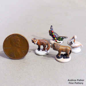4 polychrome miniature animals and birds in a set