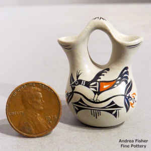 A bird, branch and geometric design on a miniature polychrome wedding vase