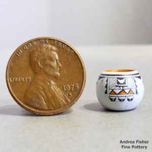 A 4-panel bird element and geometric design on a miniature polychrome jar