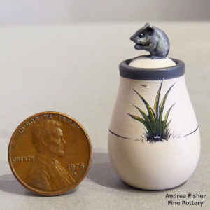 Polychrome miniature jar with a yucca design and a mouse eating on the lid