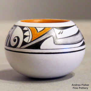 Polychrome miniature jar with a spiral, bird element and geometric design