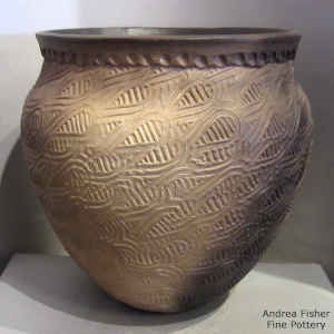 Geometric design and fire clouds on a brown jar