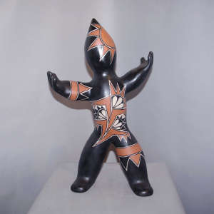 Sun face on a polychrome figure