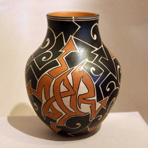 Stylized Santo Domingo geometrics decorate a polychrome jar
