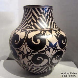 Black and white geometric design on a polychrome jar