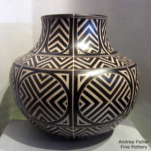 Black and white geometric design on a polychrome jar