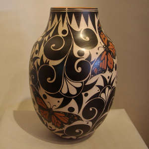 Butterfly and geometric design on a polychrome jar