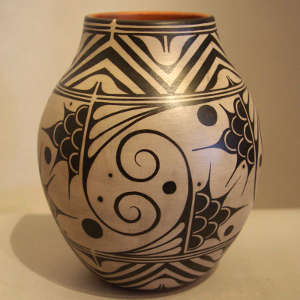 Black and white floral and geometric design on a polychrome jar