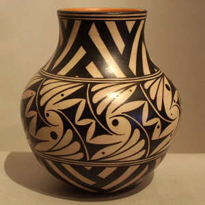 Black and tan geometric design on a polychrome jar