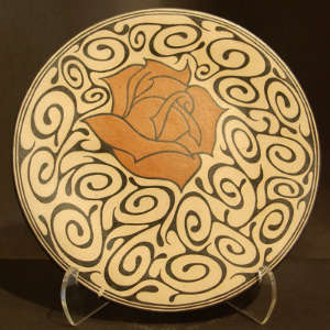 Rose and geometric design on a polychrome plate