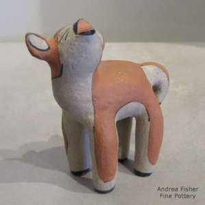 Howling polychrome coyote figure