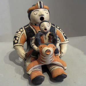 One child and an antelope on a polychrome storyteller