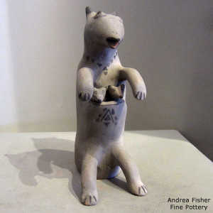 2 joeys in the pouch of a black and gray kangaroo figure