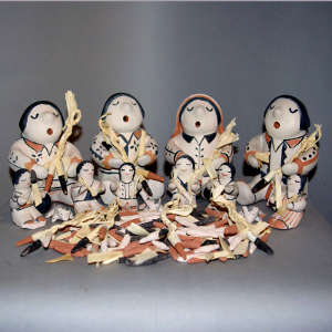 Six children shucking corn with four singing mothers