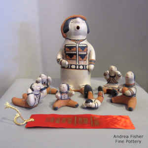 6 children with a storytime grandfather