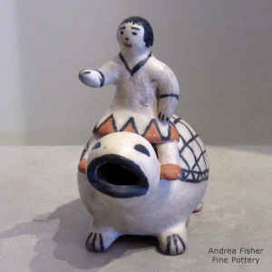 A child riding on a turtle