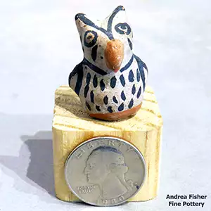 A miniature polyvhrome owl figure