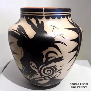 Black-on-cream jar with a human face and geometric design