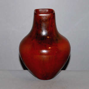 Square opening and black fire clouds on a red jar