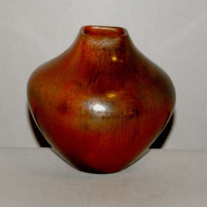 Fire clouds and pine pitch coating on a brown jar