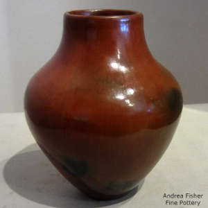 Fire clouds and pine pitch coating on a brown jar