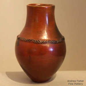 Fire clouds, rope biyo' and pine pitch coating on a brown jar