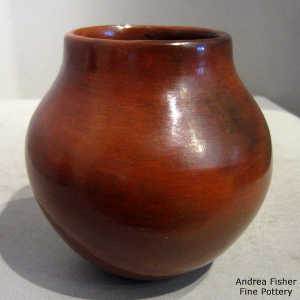 Fire clouds and pine pitch coating on a polished brown jar