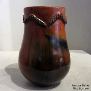 Fire clouds, braided rope biyo' and pine pitch coating on a brown jar
