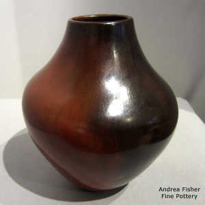 Fire clouds and pine pitch coating on a brown jar