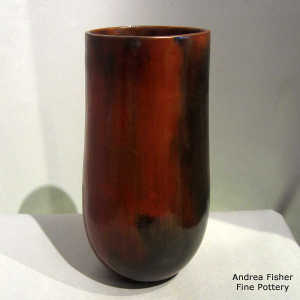 Fire clouds and pine pitch coating on a brown cylinder