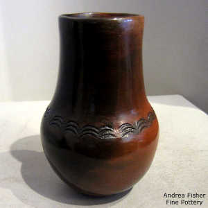 Fire clouds, impressed biyo' and pine pitch coating on a brown jar