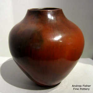 Fire clouds and pine pitch coating on a brown jar